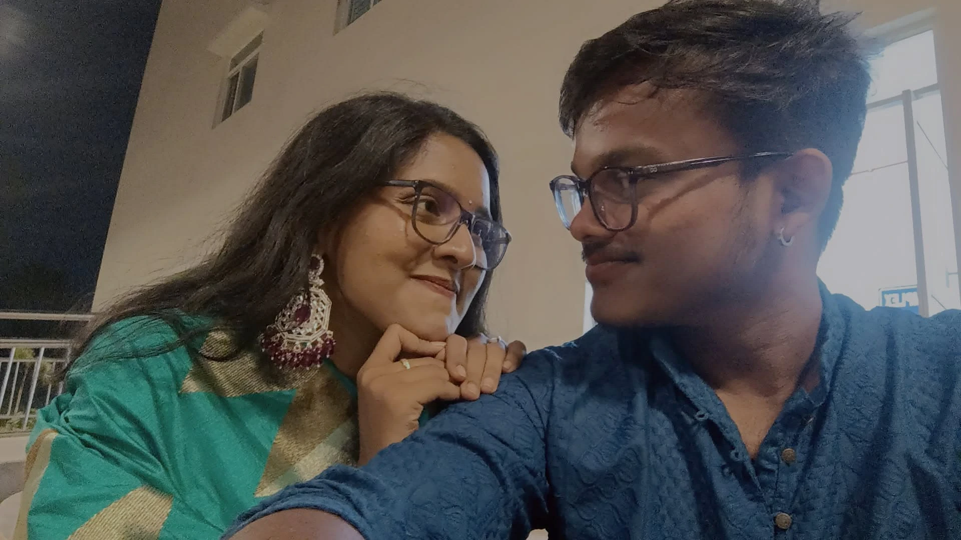 Looking at one another in our blue and green outfits