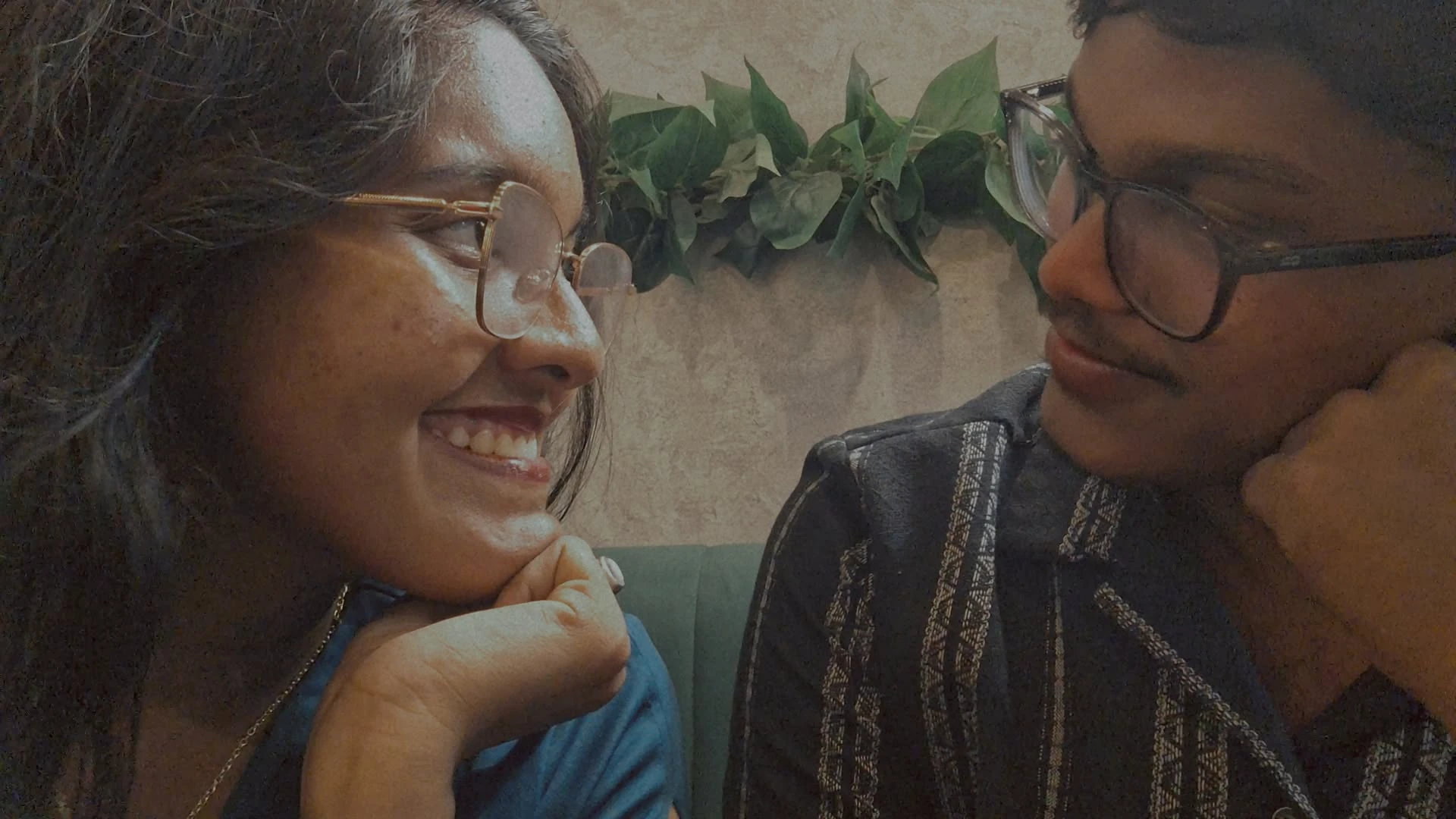 Smiling across from each other at a cafe